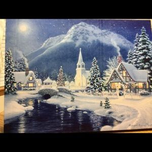 Picture canvas that has flashing lights in the tress and house.  Uses batteries